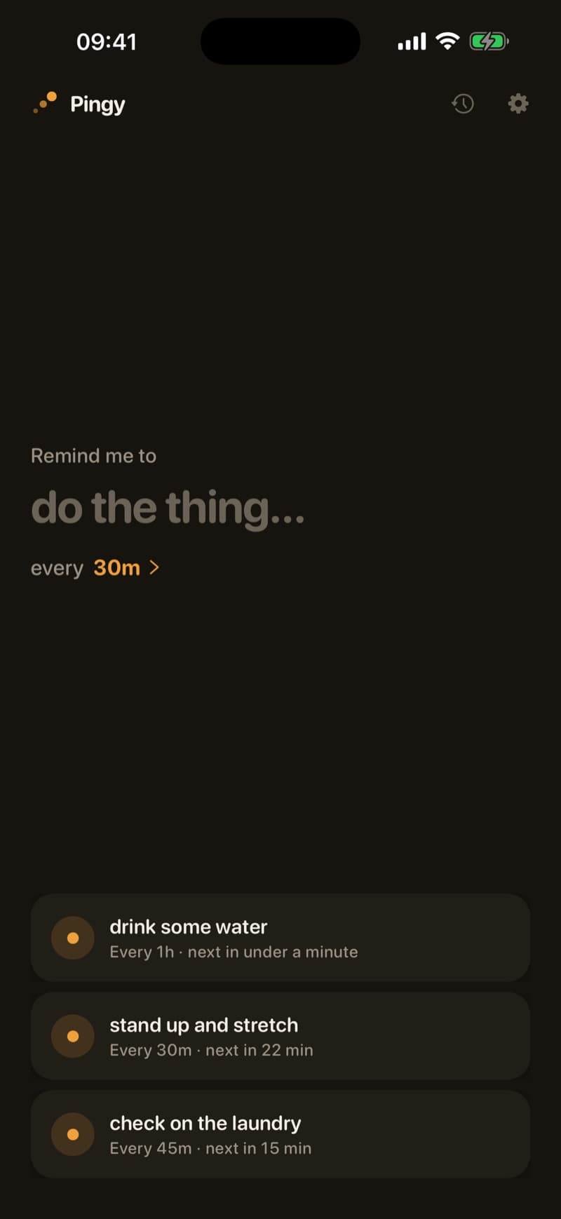 The home screen in Pingy's warm dark theme — deep brown ground with honey accents